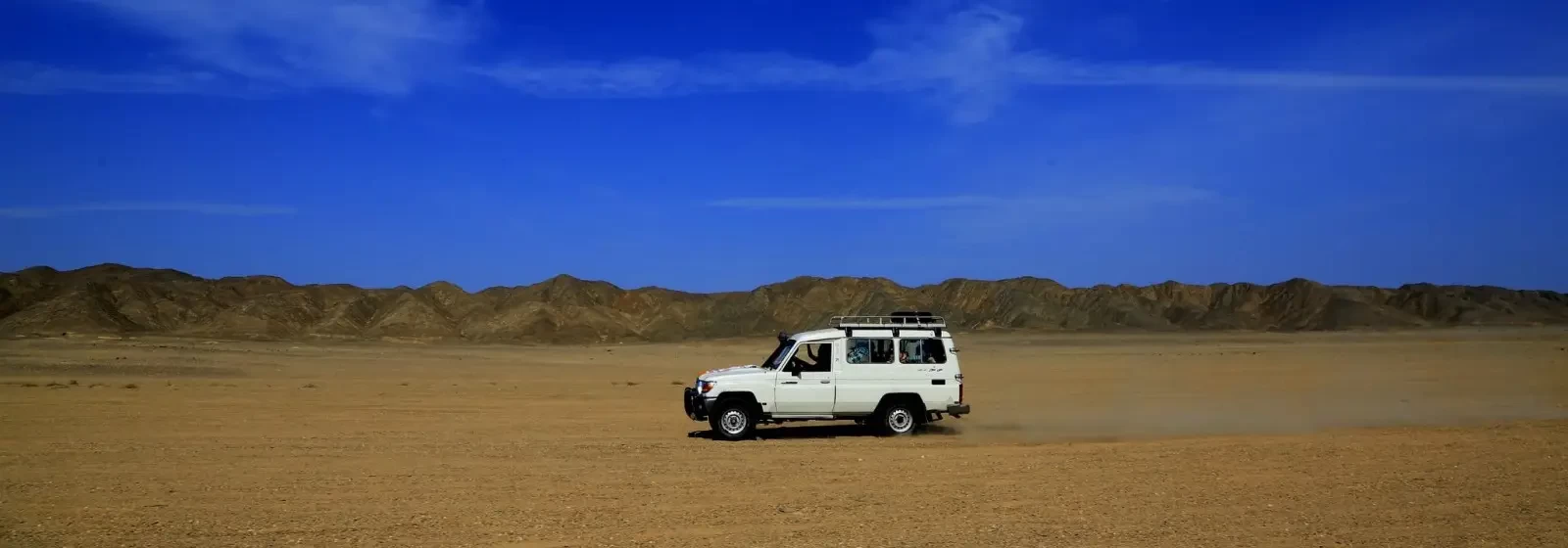 Desert jeep safari across sandy terrain